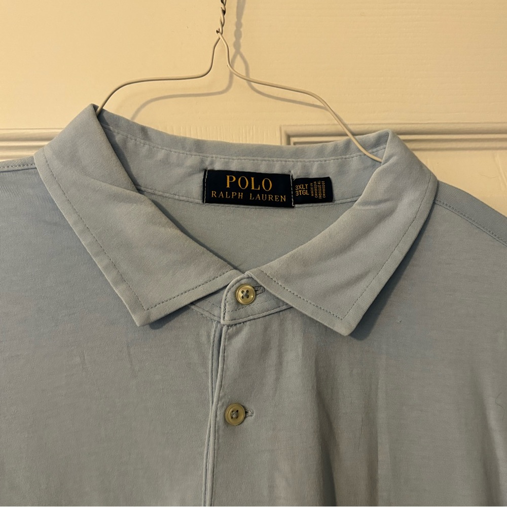 Blue short sleeve polo shirt. In good condition— worn a few times. No returns!